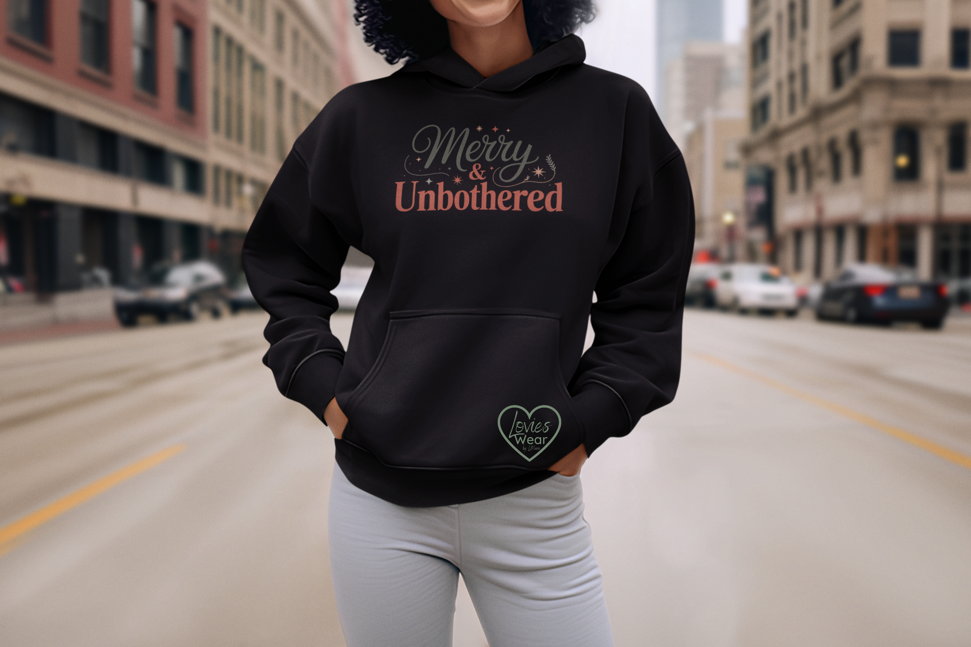 Merry and Unbothered Christmas Hoodie in black, festive minimalist holiday design by Lovies Wear