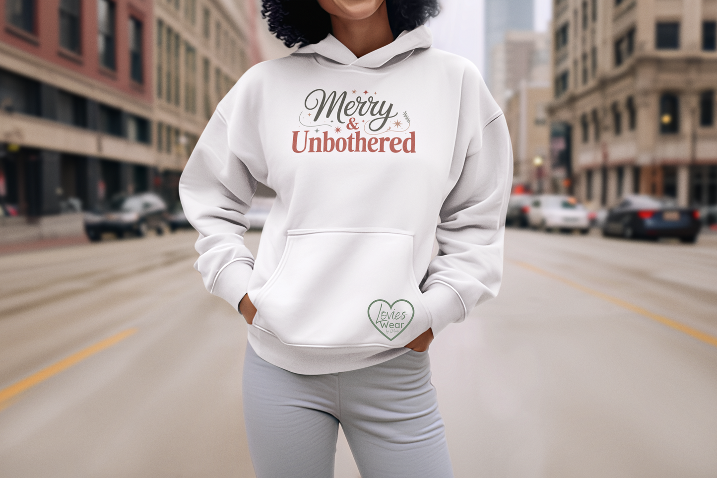 Merry and Unbothered Christmas hoodie in white, festive minimalist holiday design by Lovies Wear